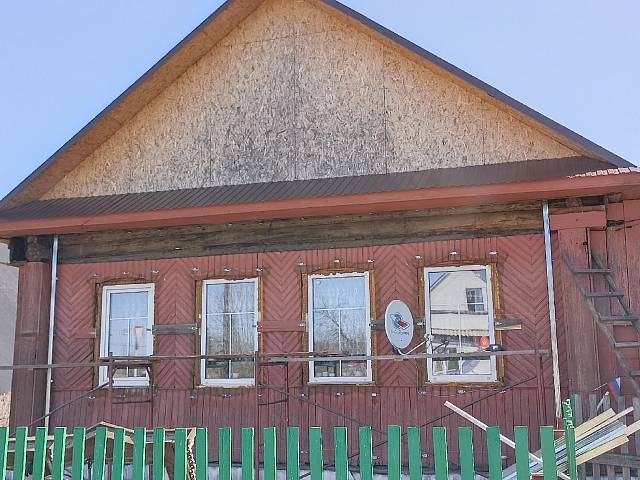 Отделка дома фасадными панелями в поселке Малино